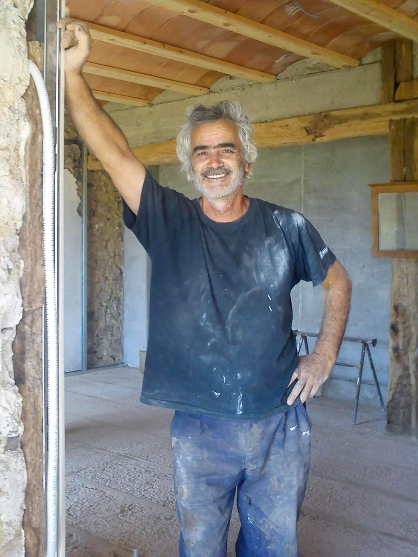 Alfredo restoring vernacular stone and timber in Casa de Aja
